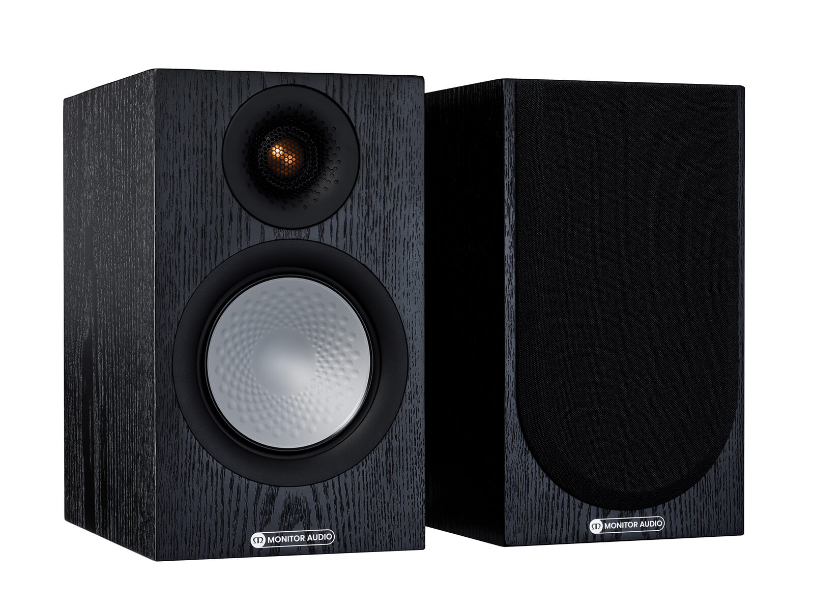 A pair of Monitor Audio's Silver 50 7G, in a black oak finish, iso view, with and without grilles.