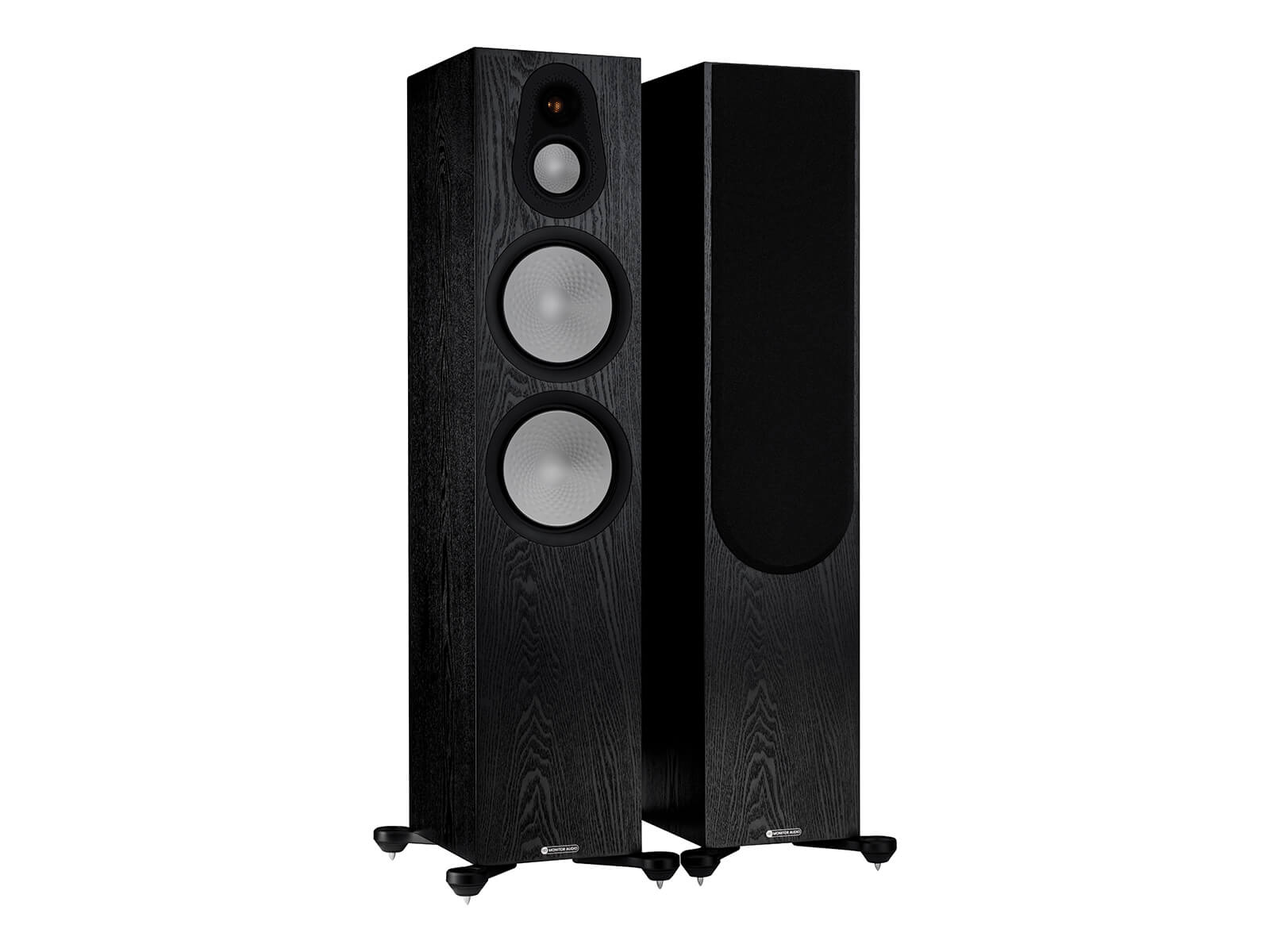 A pair of Monitor Audio's Silver 500 7G, in a black oak finish, iso view, with and without grilles.